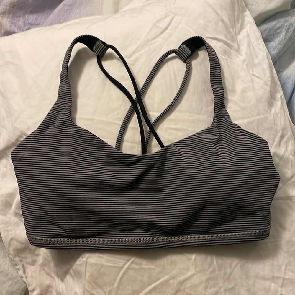 Black/gray pinstripe sports bra with crisscross straps.  EUC with bra pads.